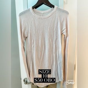 Lululemon knit sweater with thumb holes in cream. Size 10.